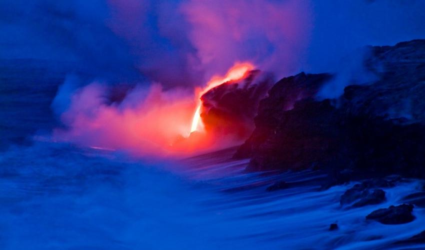 Lava entering the ocean at dusk