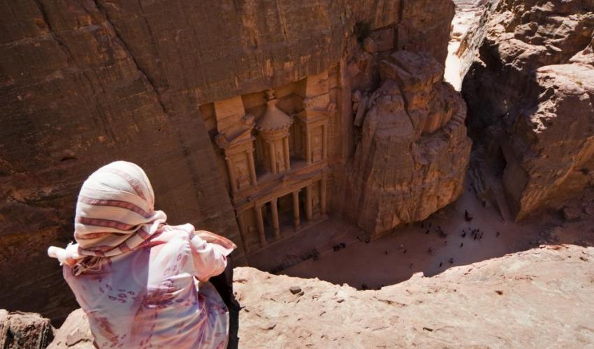 Jordanian woman looking out onto Petra
