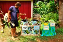 Kōkua Hawaiʻi founder Jack Johnson sorting waste 