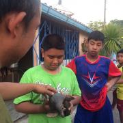 Local youth with a rescued pangolin 